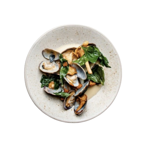 top view of an oyster dish with pieces of spinach on a plate